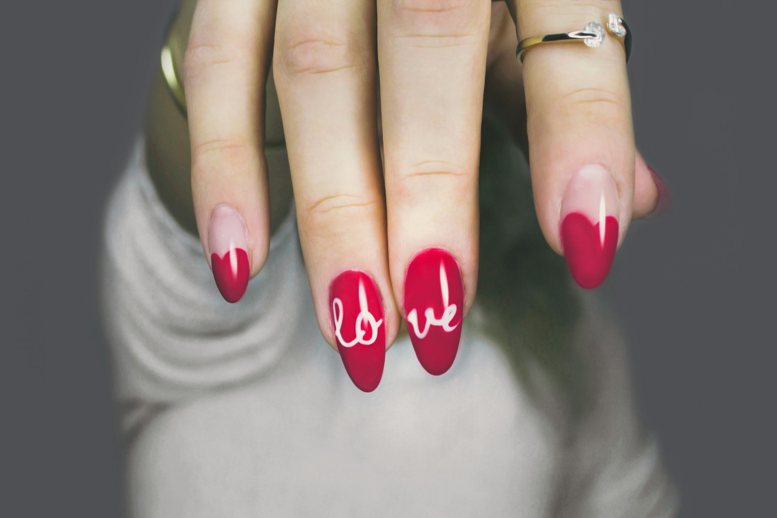 Red almond nails with hand-lettered nail art