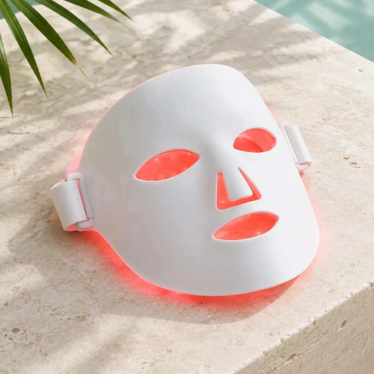 Illustrative photo: Unbranded white LED face mask with a red glow